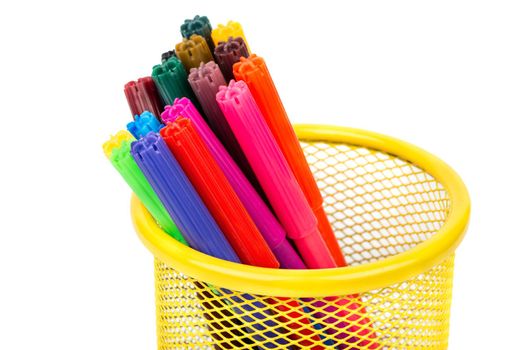 Several multi-colored markers in the pencil case close up on a blank white background
