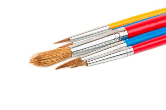 Set of paint brushes on white background close-up