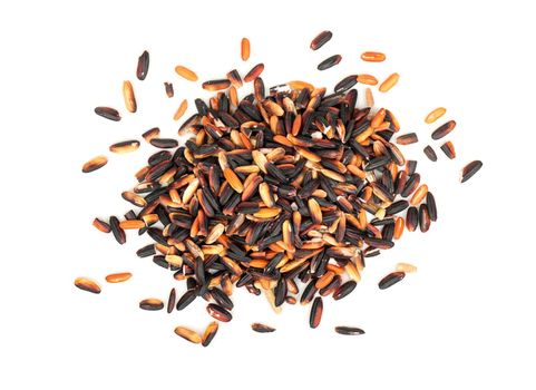 Pile of raw wild rice on white background, top view