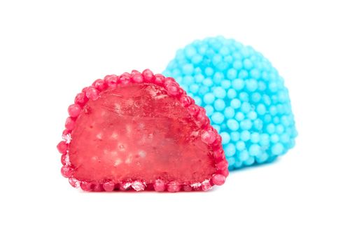 Blue berry jelly candy with red half on a white background
