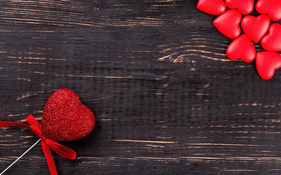 Various hearts Valentine's Day on a dark wooden background