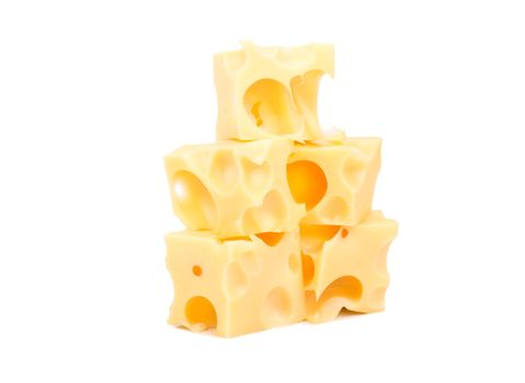 Several cubes of cheese with holes on a white background