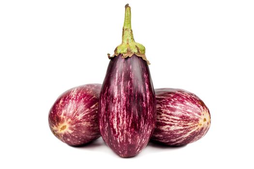 Three raw purple eggplant graffiti on white background