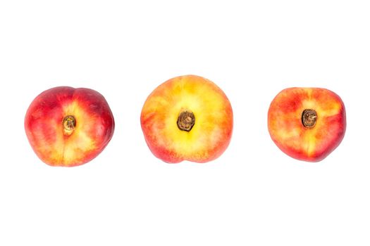 Three ripe flat peach isolated on white background, top view