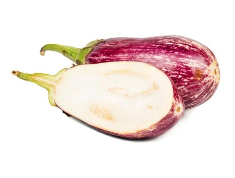 Fresh purple eggplant with half on white background