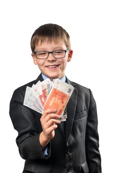 Portrait of a schoolboy holding a euro in his hand on a white background