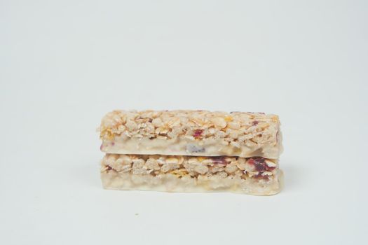 Almond , Raisin and oat protein bars on table .