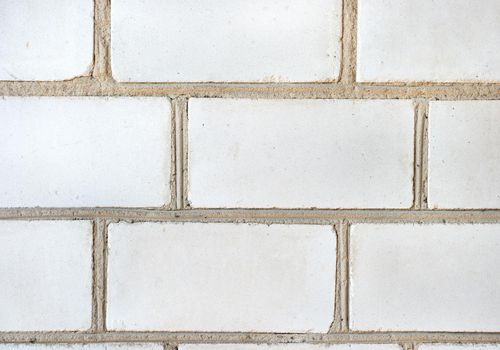 Background of old white brick wall close up