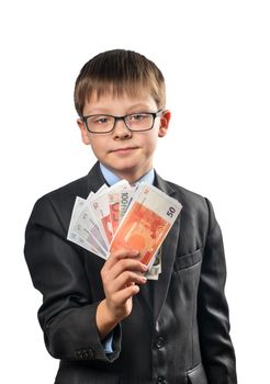 Portrait of a schoolboy holding a euro in his hand on a white background