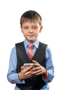 Schoolboy holding a smartphone in the hands on a white background