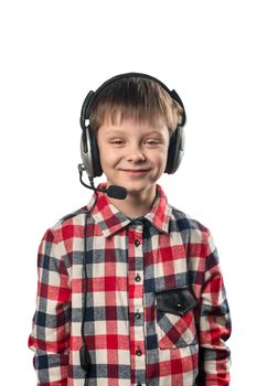 Little boy in headphones with microphone on white background