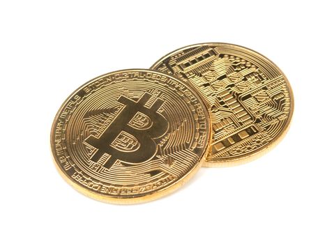 Two gold coins bitcoins on a white background