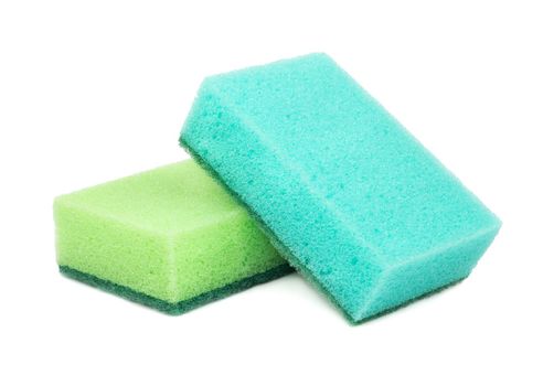 Green and blue dish washing sponge on white background