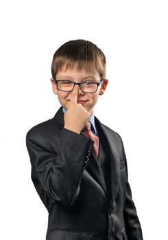 Portrait of a schoolboy adjusting glasses on a white background