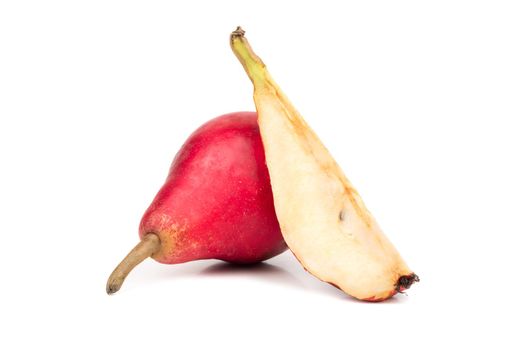 Ripe red pear with a slice isolated on white background