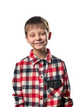 Laughing boy in a shirt on a white background