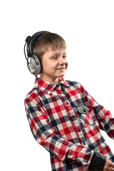 Little boy enjoys music in headphones over white background