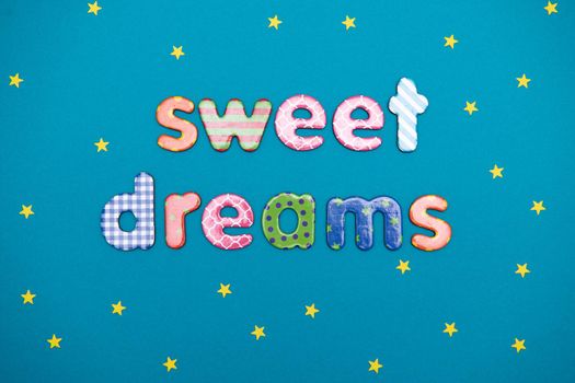message sweet dreams on a blue background with stars