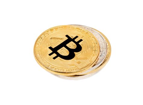 Stack of gold and silver bitcoins on a white background