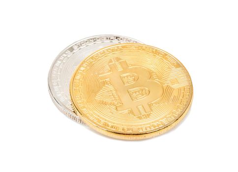 Gold and silver bitcoin coins on a white background