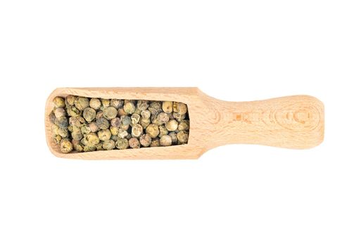 Green pepper peas in wooden scoop on white background, top view