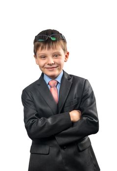 Portrait of smiling schoolboy in a suit on white background