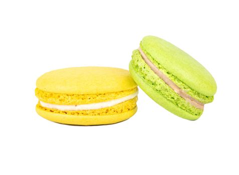 Green and yellow macaroon isolated on white background