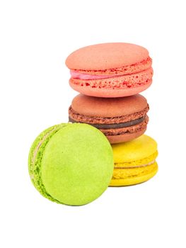 Four multicolored macaroons on a white background