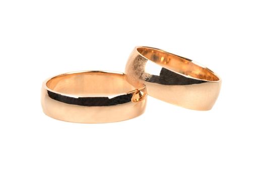 Couple wedding gold rings on white background