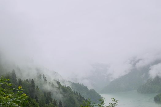 Mountain lake in the fog.