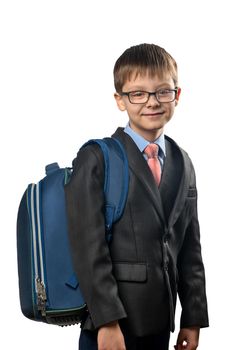 Schoolboy wearing glasses and with a backpack on a white background
