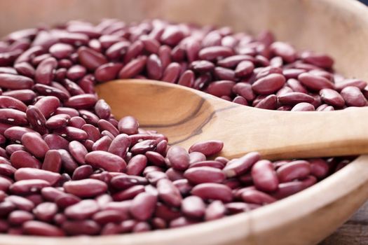 Dried Kidney beans in wooden bowl with spoon