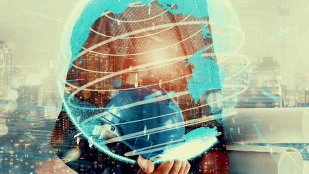 Future building construction and inventive engineering project concept with HUD hologram graphic design. Building engineer, architect people or construction worker works with modern civil technology.