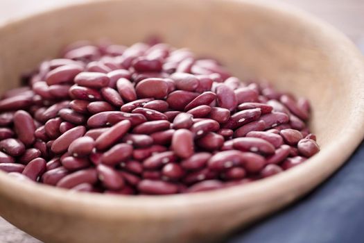 Dried kideny beans in wooden bowl.