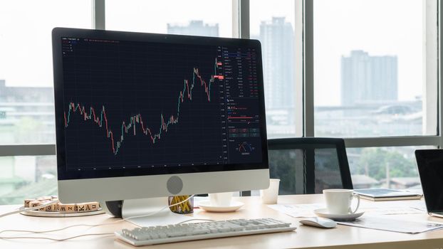 Stock market data chart analysis by ingenious computer software . Investment application display stock market chart on the computer screen and advise trading decision .