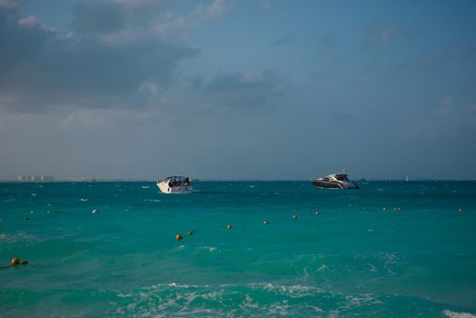 The boat in the Caribbean Sea on a sunny day. Clear water.