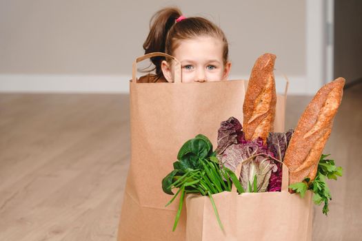 Paper bag with vegetables and some bread with copy space