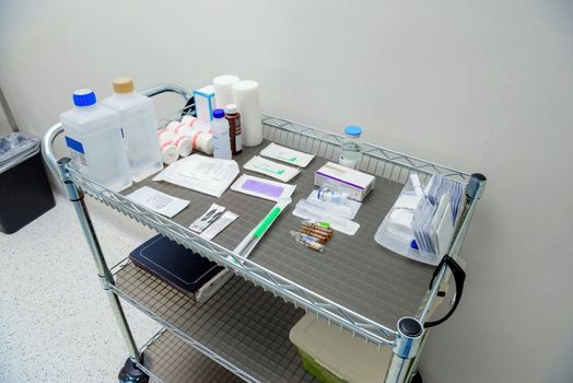 Medications prepared for surgery on table.