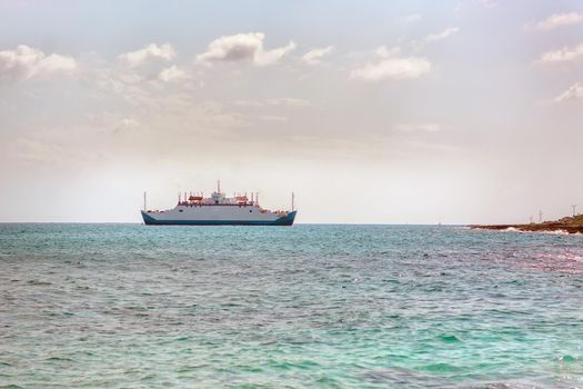 Cargo and passenger ferry is white in the sea. Mexico.