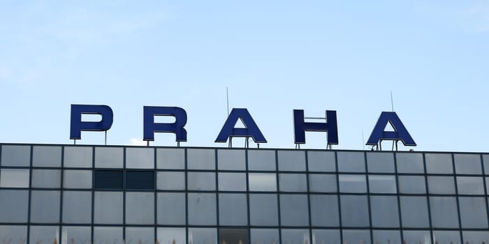 Prague, Czech Republic - July 28th, 2018: Label PRAHA ("Prague" in czech language) on Ruzyne, Vaclav Havel Airport, glass windows under.