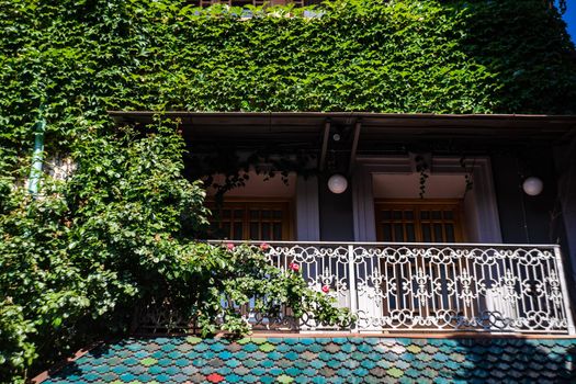 Carving balconies in Old town of Tbilisi cityin sunny summer day