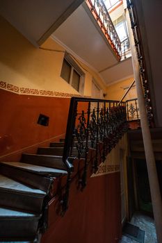 Old Tbilisi's maison stairways with spiral staircase decorated with carving metal holder