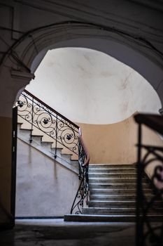 Old Tbilisi's maison stairways with spiral staircase decorated with carving metal holder