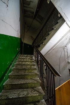 Old Tbilisi's maison stairways with spiral staircase decorated with carving metal holder