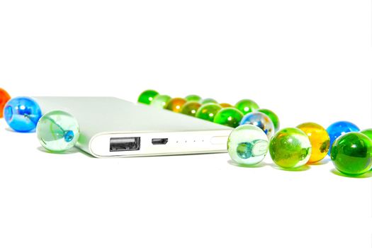 a high capacity, self-contained storage device containing a read-write mechanism plus one or more hard disks, inside a sealed unit. Portable hard drive with colorful glass balls.