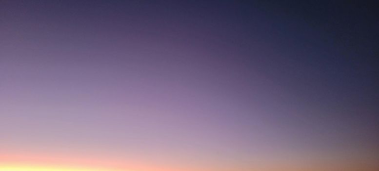 image of colorful sky with dark clouds in late afternoon in Brazil