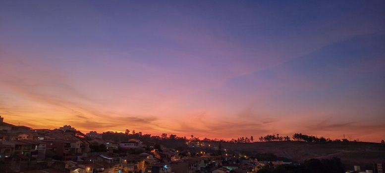 image of colorful sky with dark clouds in late afternoon in Brazil