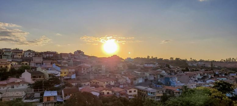 image of colorful sky with dark clouds in late afternoon in Brazil