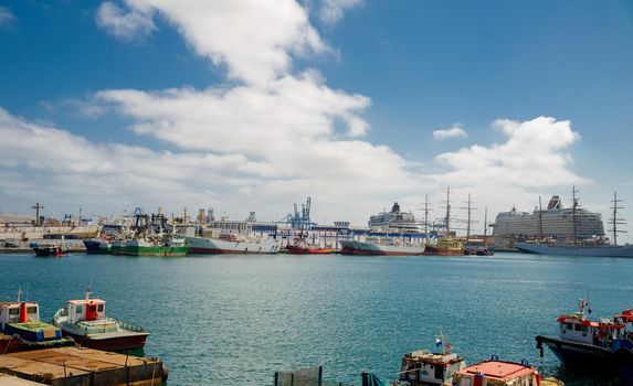 February 04 2022-Las Palmas, Gran Canaria, Spain .View on the Port of Las Palmas, Gran Canary with many kinds of passenger and cargo ships in the background and foreground