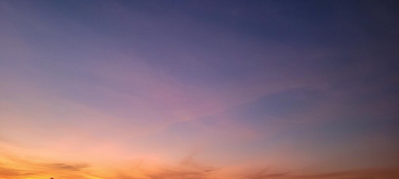 image of colorful sky with dark clouds in late afternoon in Brazil